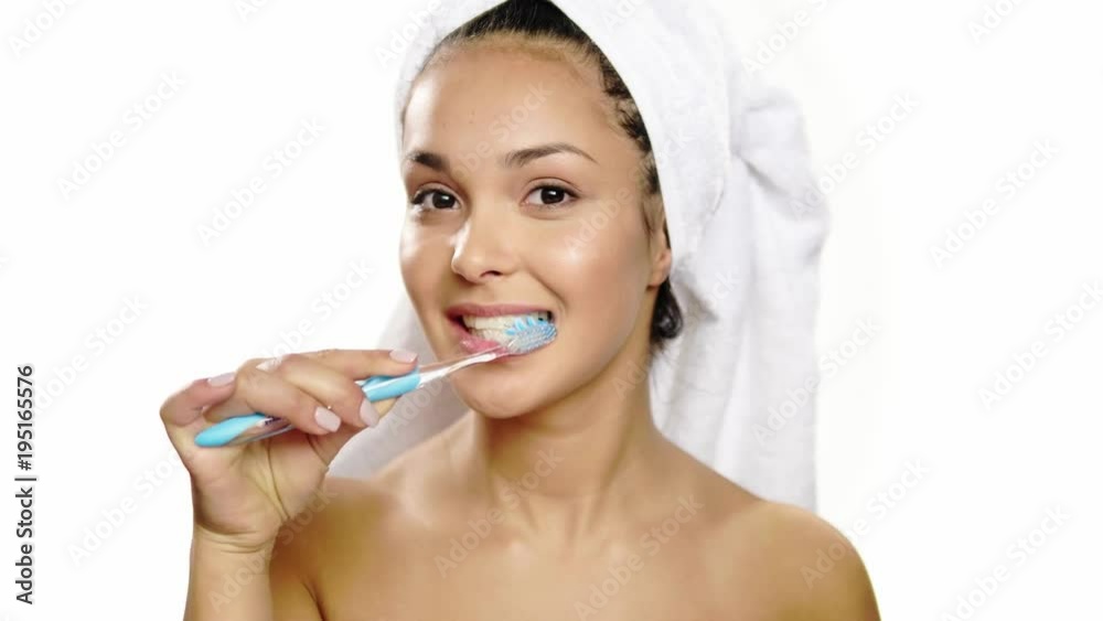 Beautiful woman brushing her teeth. Beautiful woman brushing her teeth.