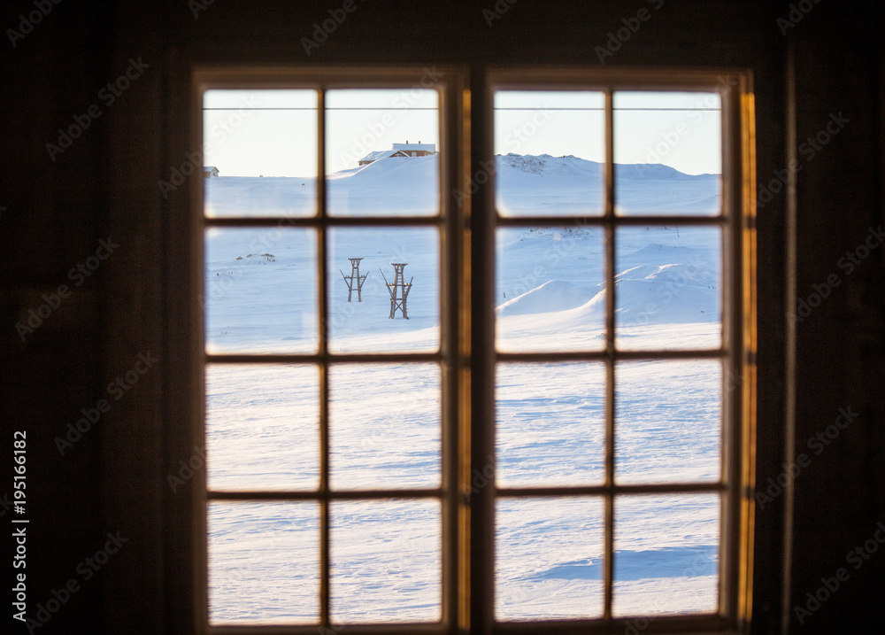Beautiful wooden window with frozen ice flowers in Norwegian town. Beautiful wooden window with frozen ice flowers in Norwegian town.