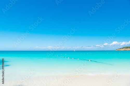 Fototapeta Naklejka Na Ścianę i Meble -  Sea or ocean beach with sand, turquoise water in antigua