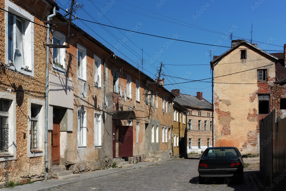 View of the old german shabby buildings in Pravdinsk (prior Friedland), Russia. Pravdinsk was founded in 1312 by the Teutonic Knights. The city is located 53 km. of Kaliningrad (Konigsberg).