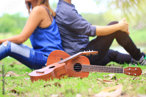 Ukulele guitar with Happy couple enjoying in the garden, Love Story Concept