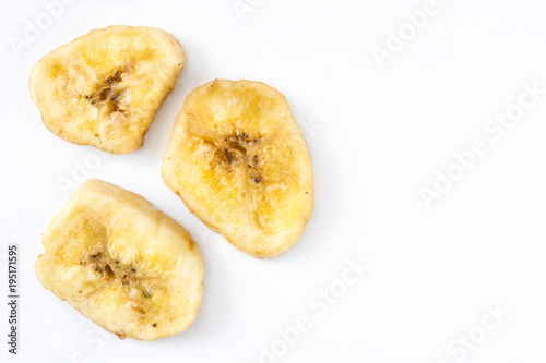 Close up banana chips isolated on white background. Top view. Copyspace