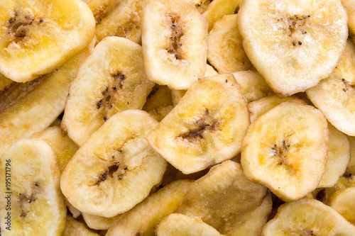 Banana chips background. Top view © chandlervid85