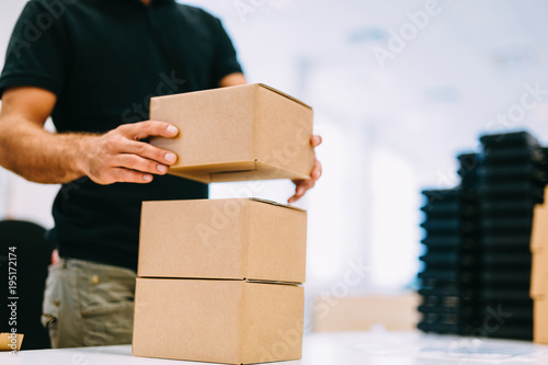 Picture of man boxing products for dispatching