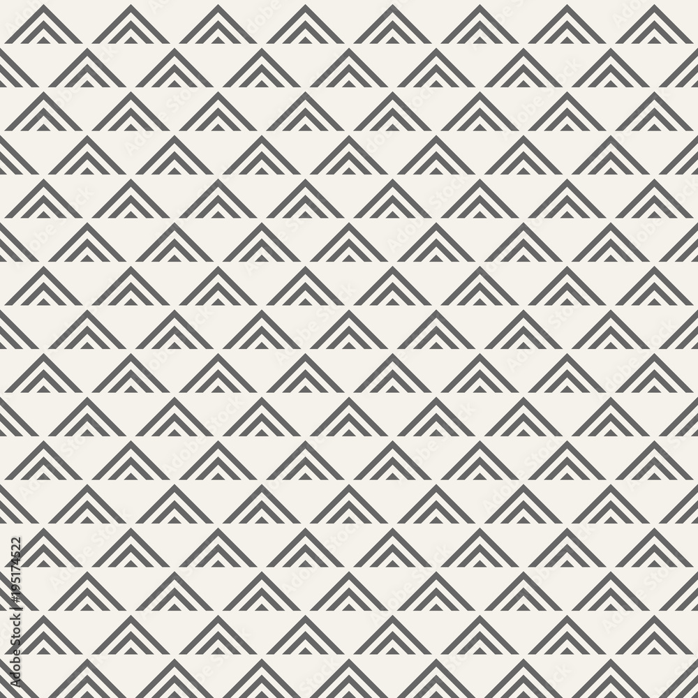 Regularly repeating geometric tiles of striped triangles.