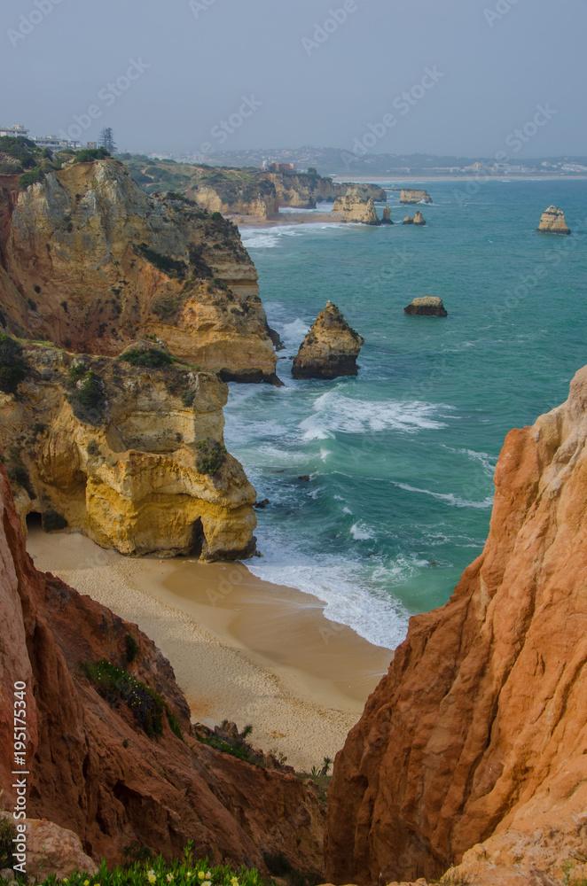 Tiny sandy Praia do Camilo beach near Lagos, Portugal.