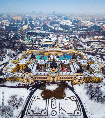 Budapest, Hungary - Aerial skyline view of the famous Szechenyi Thermal Bath in City Park (Varosliget) on a snowy winter morning photo