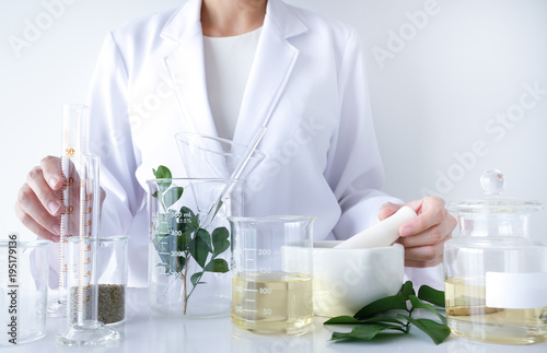 the scientist,doctor, make alternative herb medicine with herbal the organic natural in the laboratory. oil capsule, natural organic skincare and cosmetic.