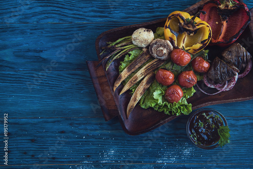 Grilled vegetable on a blue...