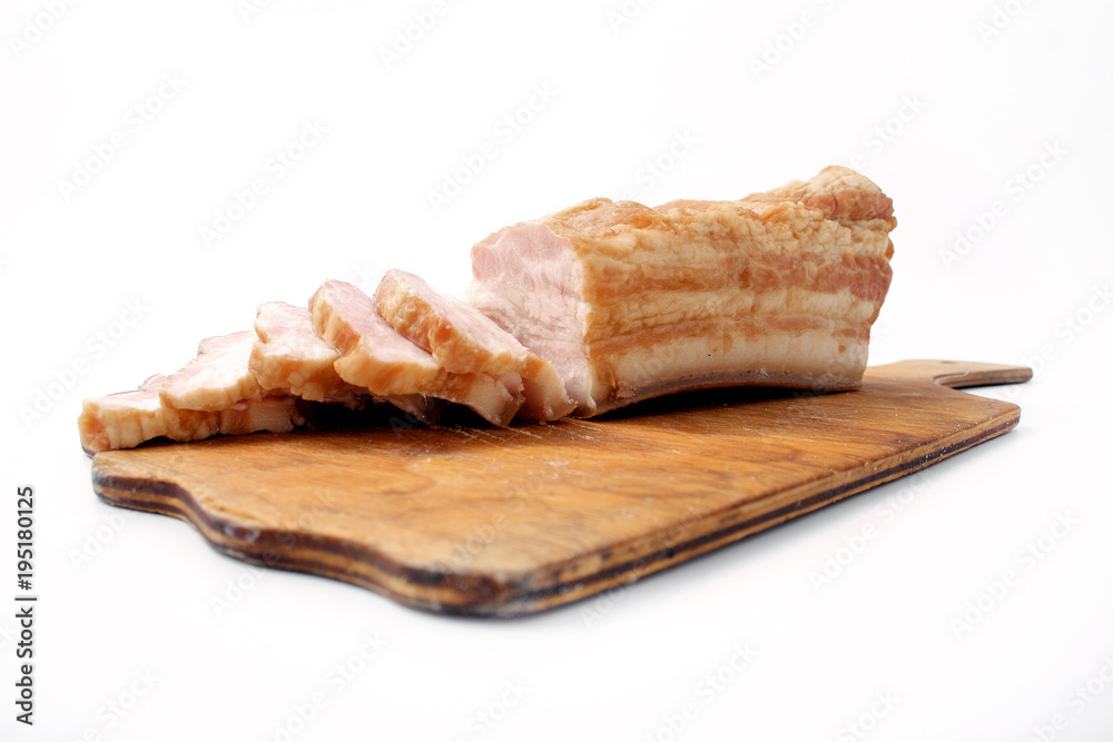 bacon sliced on white background. pork fat with veins.