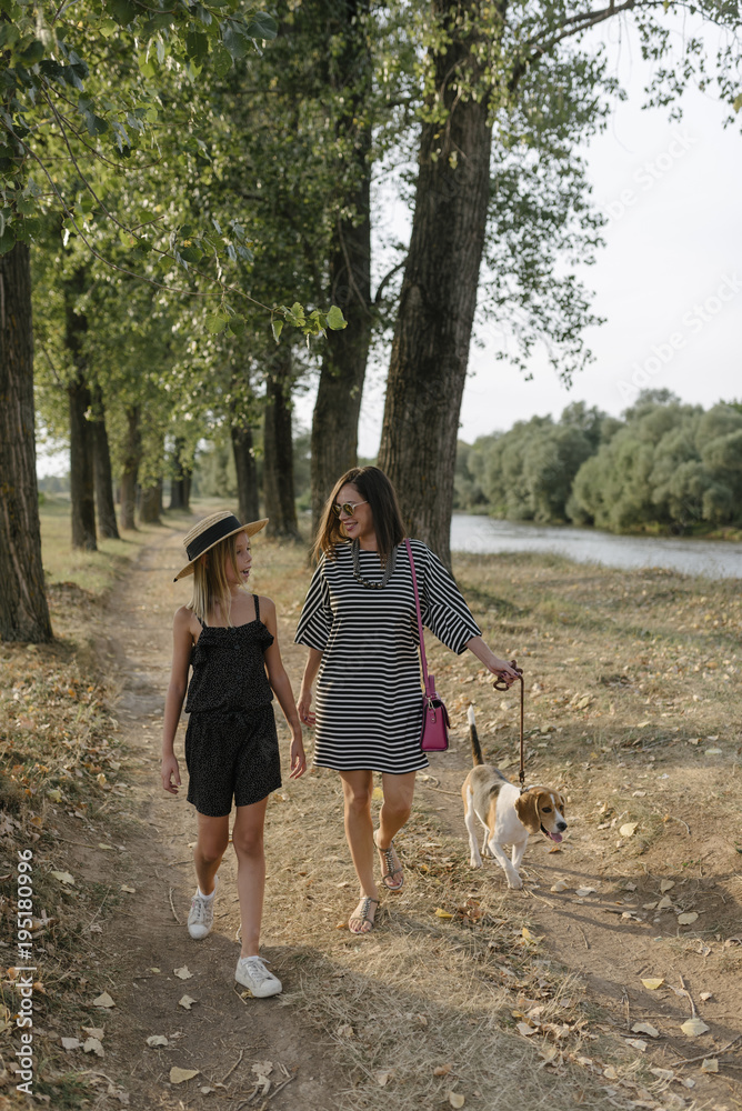 Fototapeta premium Two sisters spending quality time bonding outdoors