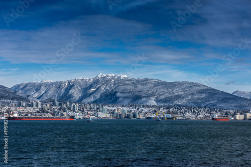 Tanker and Rocky Mountains, North Vancouver, British Colombia, Canada.