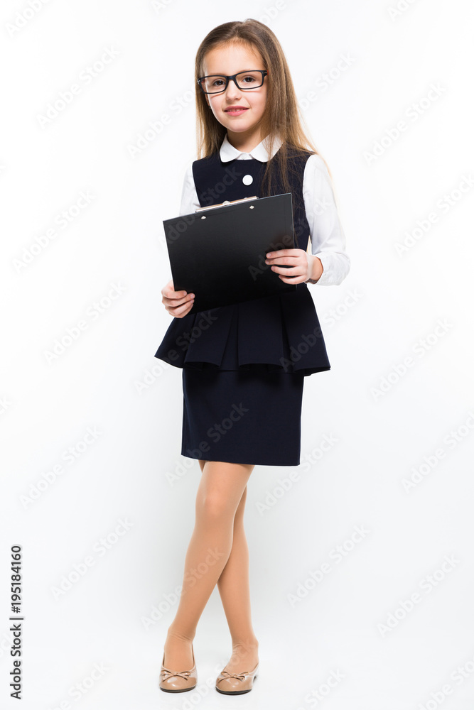 Little girl with clipboard in her hands dressed as a businesswoman Little girl with clipboard in her hands dressed as a businesswoman