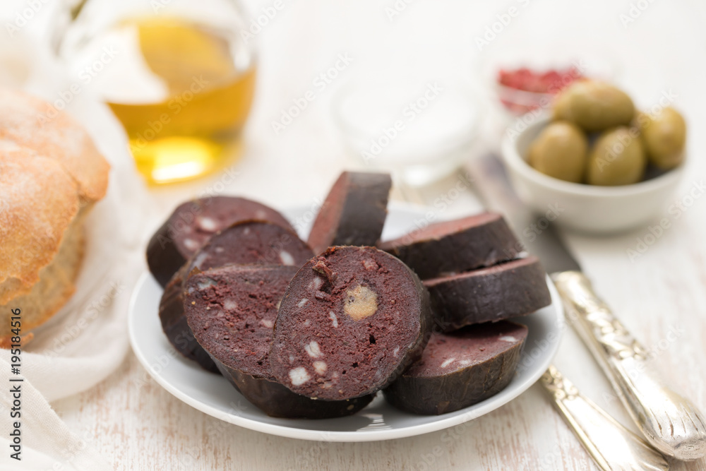 portuguese blood sausage on white plate