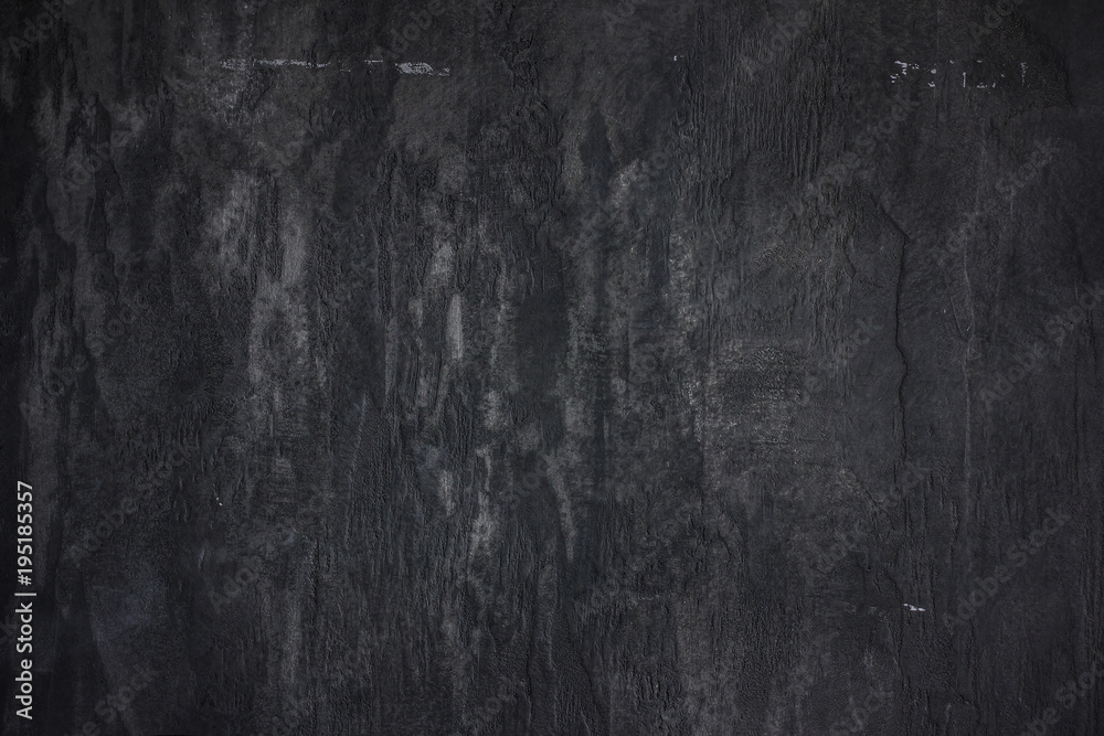 Naklejka premium The stone wall concrete textured black background