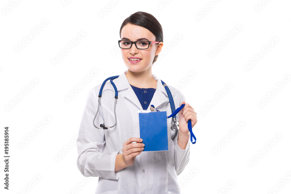Young woman doctor with stethoscope holding blue badge in her hands in white uniform on white background Young woman doctor with stethoscope holding blue badge in her hands in white uniform on white background