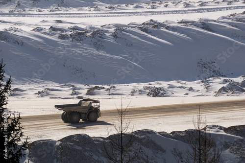 Large dump truck in a surface mine in winter