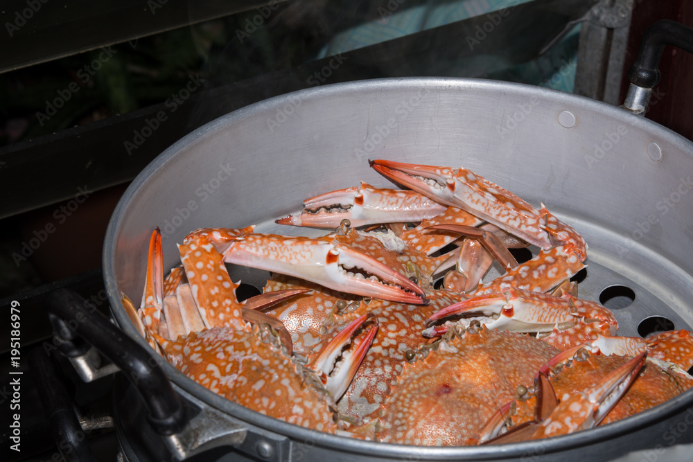 Steamed crabs in the steamer on Hot Smoke Background