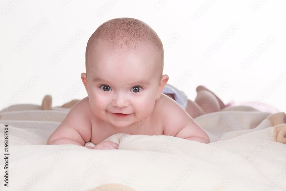 Portrait of baby boy lying on blanket. Cute little baby Portrait of baby boy lying on blanket. Cute little baby