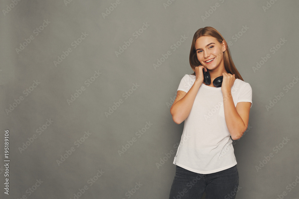 Woman with earphones, studio shot Woman with earphones, studio shot
