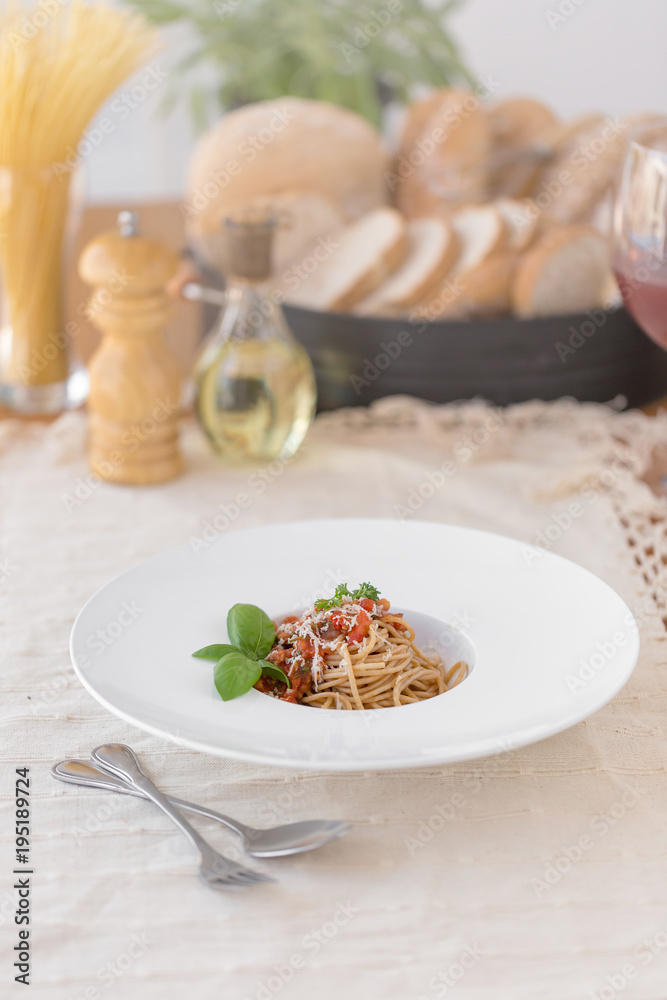 Spaghetti bolognese sauce with beef or pork,cheese,tomatoes and spices on white plate