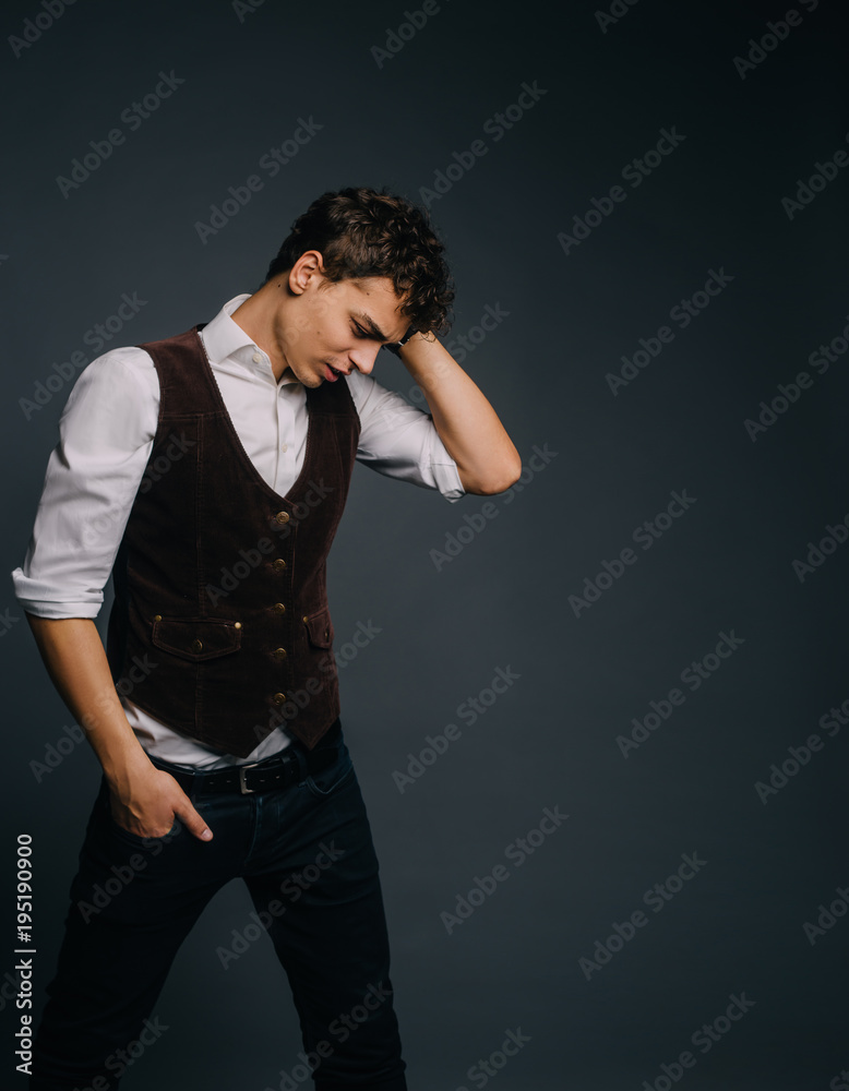 The student is shocked by the approaching event (university session). The man is stylish and elegantly dressed. The guy grabbed his head in horror. The student is shocked by the approaching event (university session). The man is stylish and elegantly dressed. The guy grabbed his head in horror.