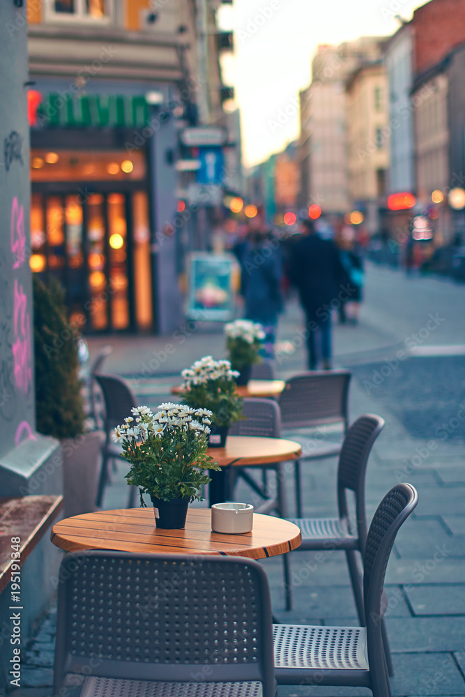 Tables of outdoor street cafe in Oslo, Norway