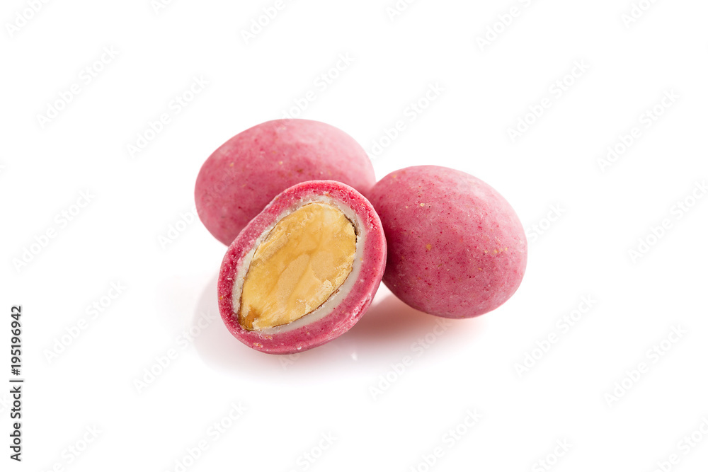 Heap of pink sugared almonds dragees isolated on white background Heap of pink sugared almonds dragees isolated on white background