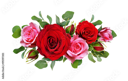 Red and pink rose flowers with eucalyptus leaves in a floral arrangement