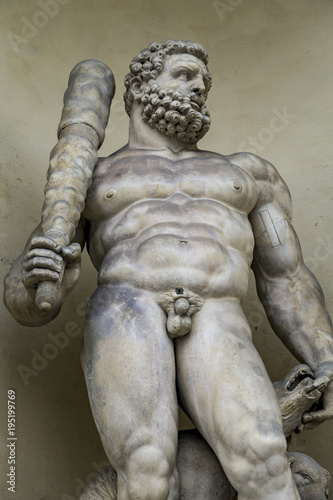 Statue of Hercules with a three headed dog at entrance of the Ducal Palace in Modena. © BGStock72