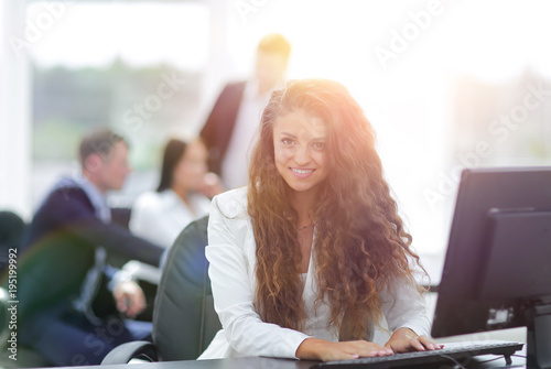 Manager woman sitting behind a Desk photo