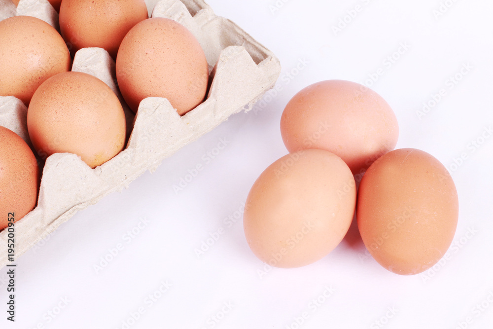 Chicken eggs in containers isolated on white background Chicken eggs in containers isolated on white background