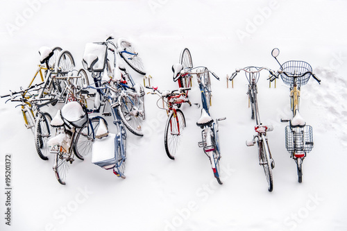 bikes in the snow - bicycles background white winter above view