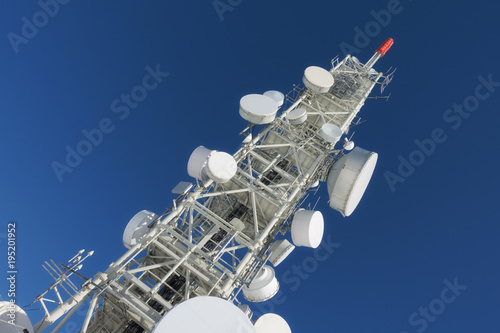 Telecommunication tower with dish antennas