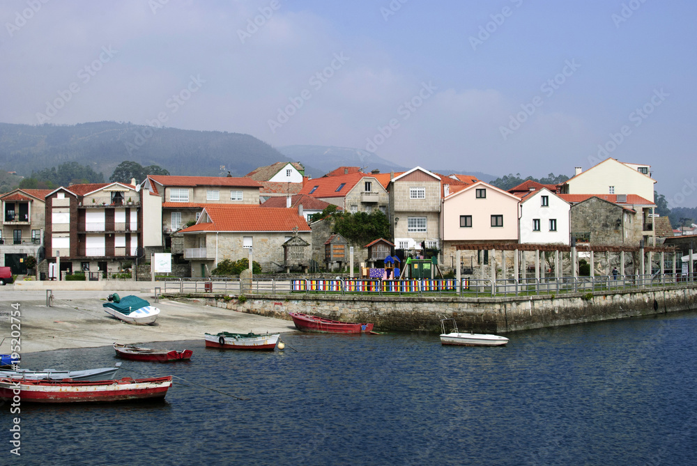 View of houses and boats in the sea at Combarro, Galicia, Spain