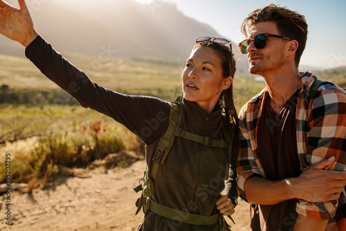 Couple of hikers on a country path