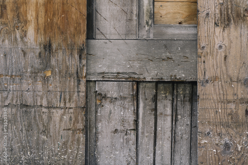 Detail of worn plywood doorway and wall Detail of worn plywood doorway and wall
