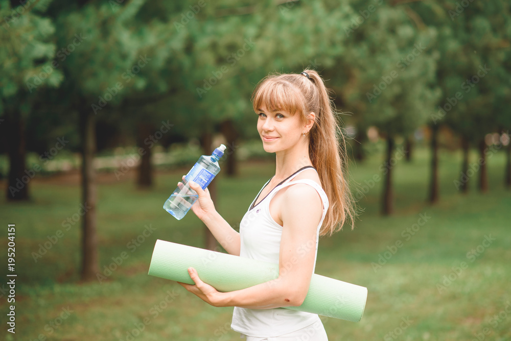 woman does Yoga in the park