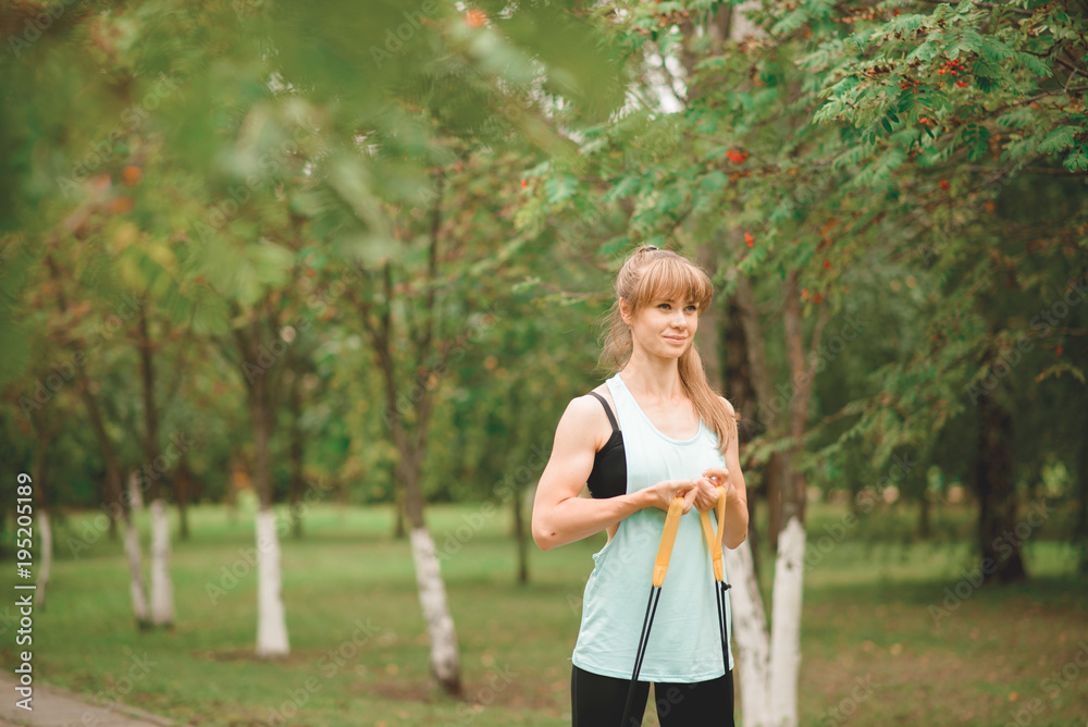 Smiling girl posing with a skipping rope Smiling girl posing with a skipping rope