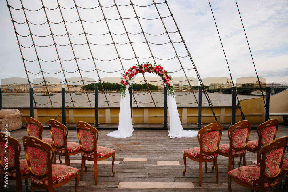 The decoration of the wedding ceremony. Wedding on the deck of the ship