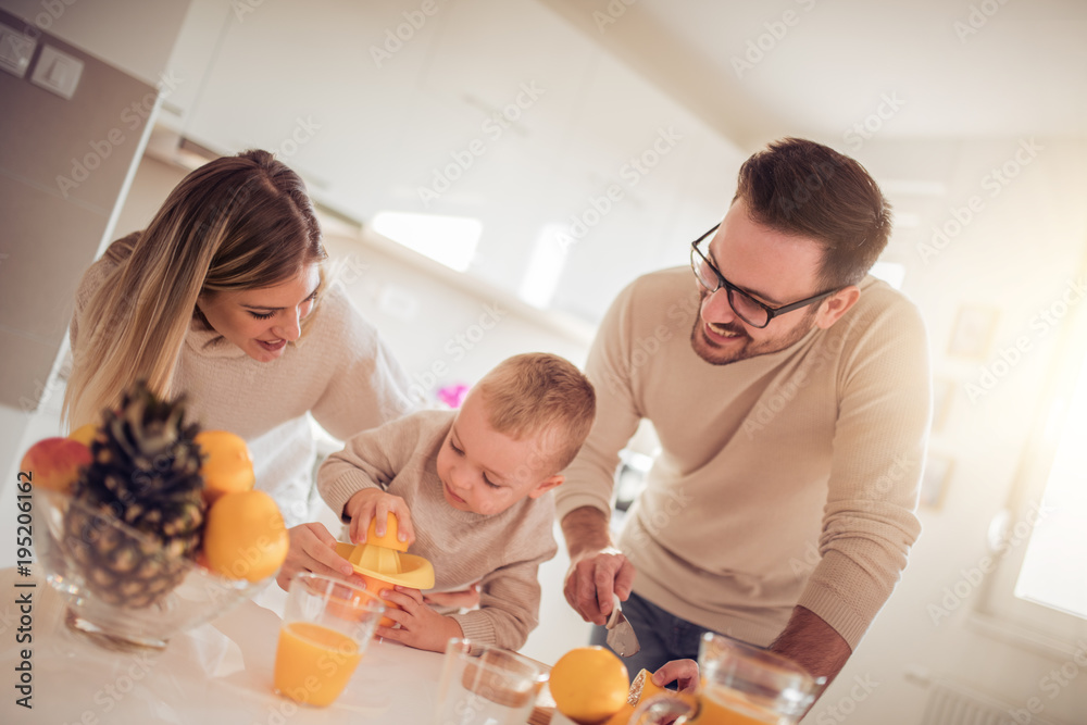 Family make fresh orange juice Family make fresh orange juice
