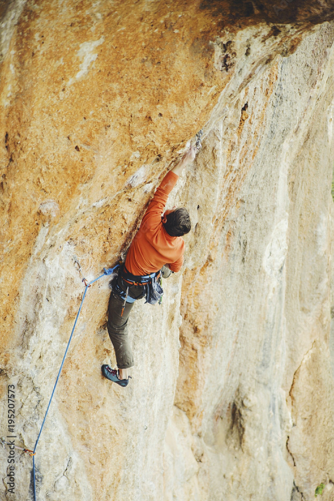 Rock-climbing in Turkey. The guy climbs on the route. Photo from the top. Rock-climbing in Turkey. The guy climbs on the route. Photo from the top.