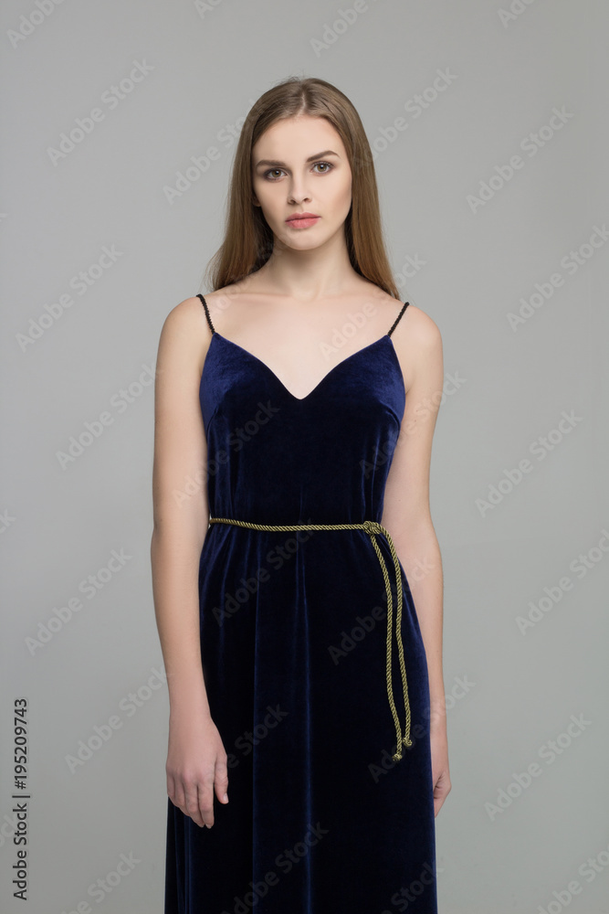 Young long-haired girl poses in long black dress Young long-haired girl poses in long black dress