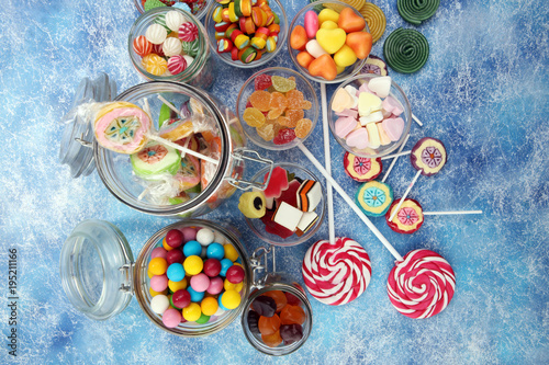 candies with jelly and sugar. colorful array of different childs sweets and treats. © beats_