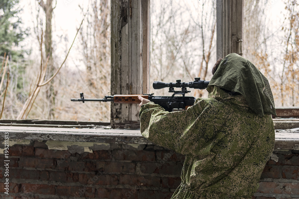 Fototapeta premium in the ruins of the building sniper waiting for the target