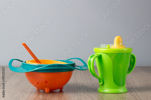 Baby plastic gyro bowl, plastic cup, spoon.