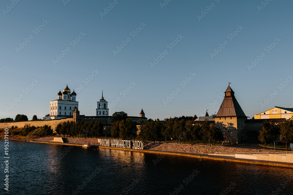 Pskov Kremlin and the Velikaya river at sunset