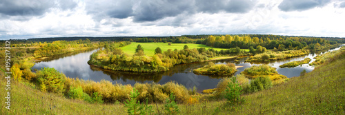 Panorama of a beautiful autumn rural landscape with a river