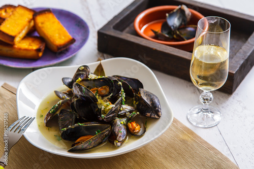 Freshly prepared mussels with vegetables in wine side view