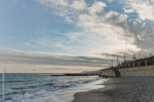 Wallpaper Mural Beautiful sea landscape. Surf Waves crashed on the shore. Stone sea pier on the sandy coastline. World of nature, environmental Torontodigital.ca